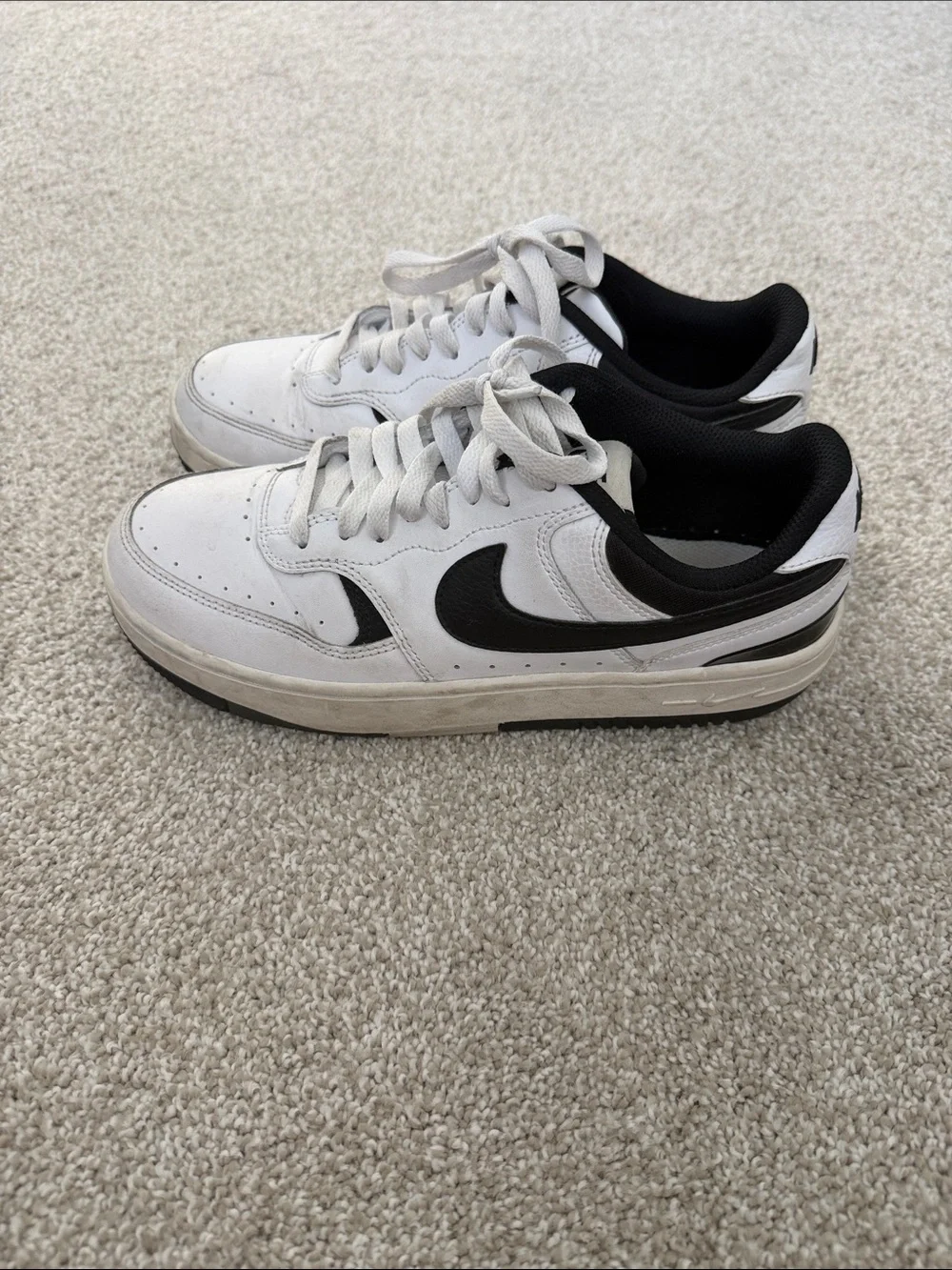 Nike White and Black Low-Top Sneakers with Swoosh